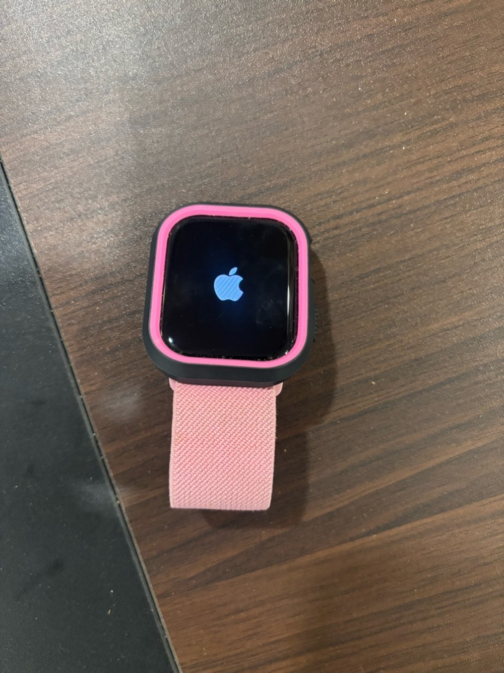 Apple Watch with Pink Sport Loop and Black and Pink Silicone Case
